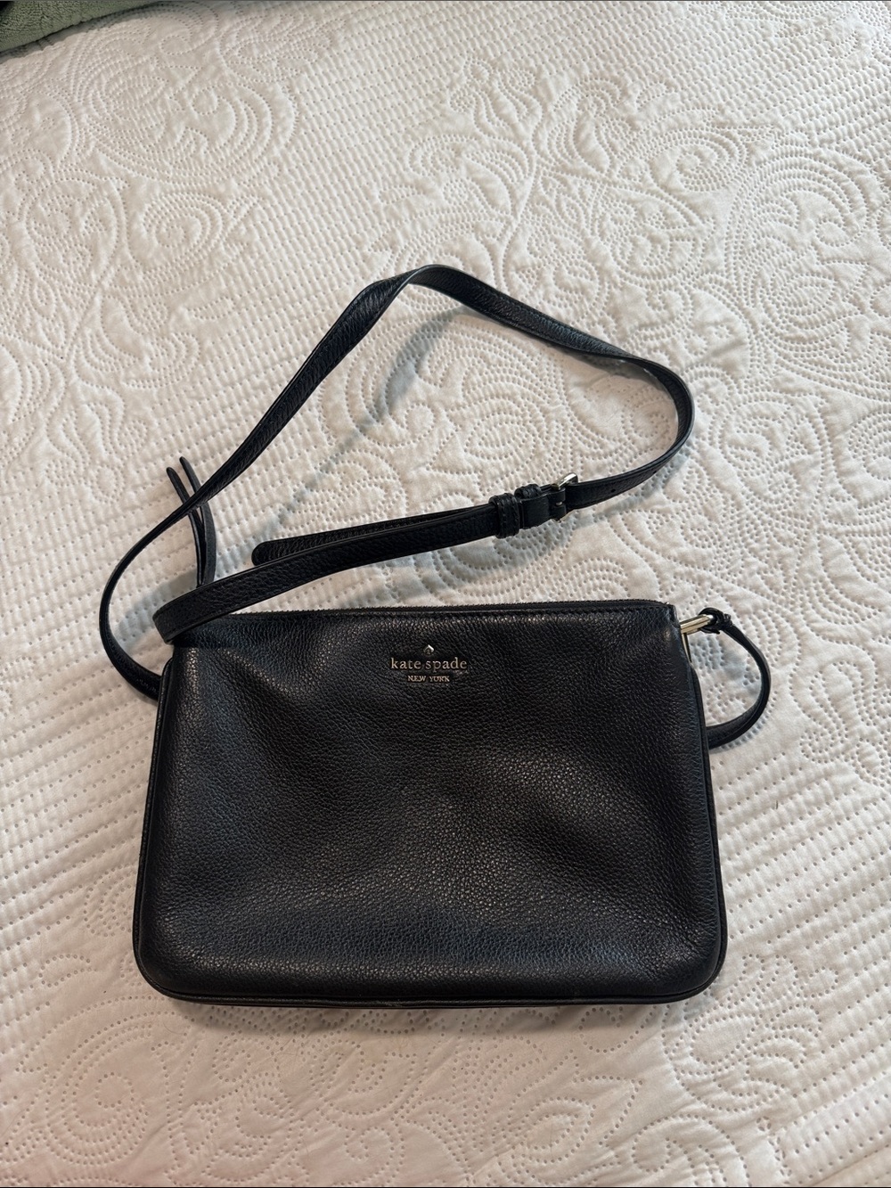kate spade black leather wristlet with gold zipper
